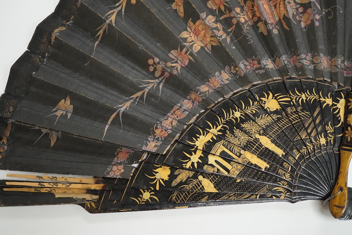 Four 19th century Chinese gilt-decorated black lacquer fans with figure painted leaves, two cased, largest 41cm